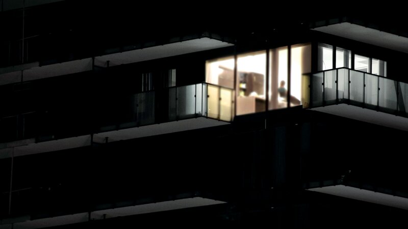 Person on Balcony at Night — Black