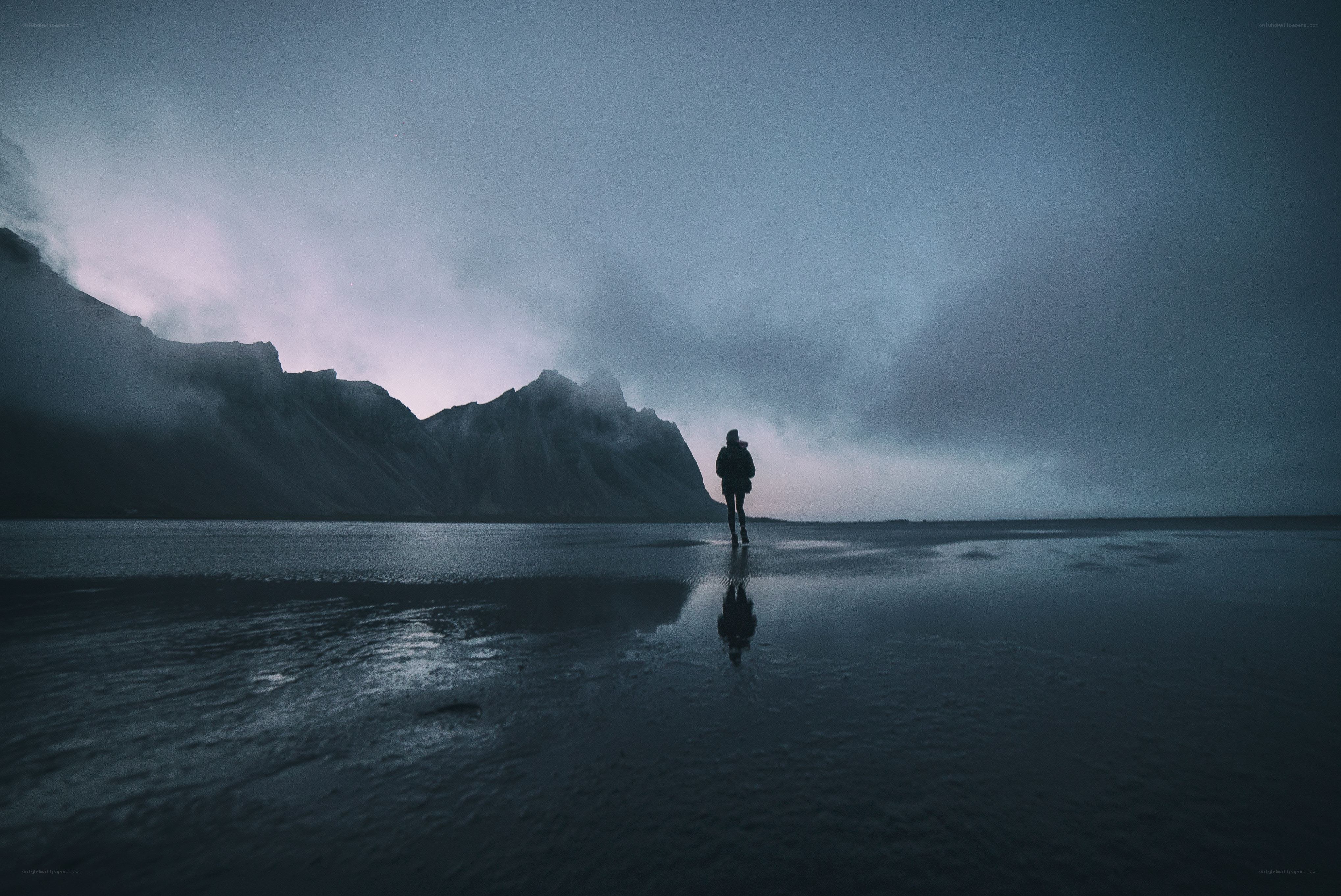 person on beach at dusk