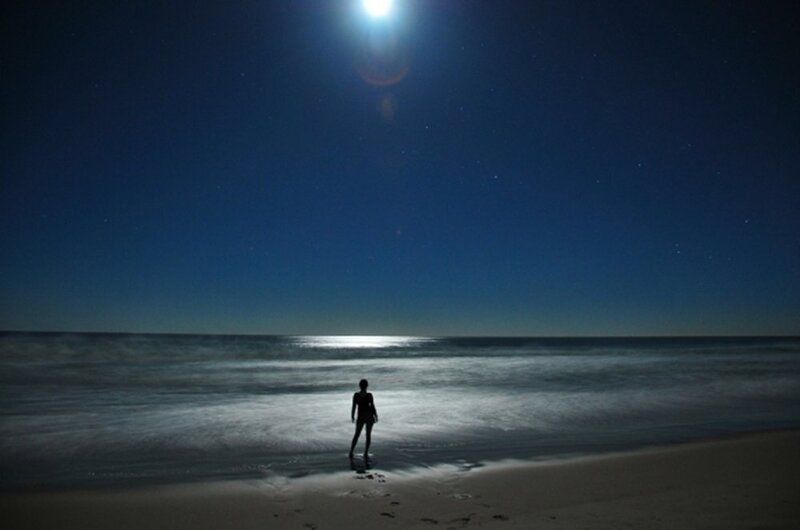 Person on beach at night