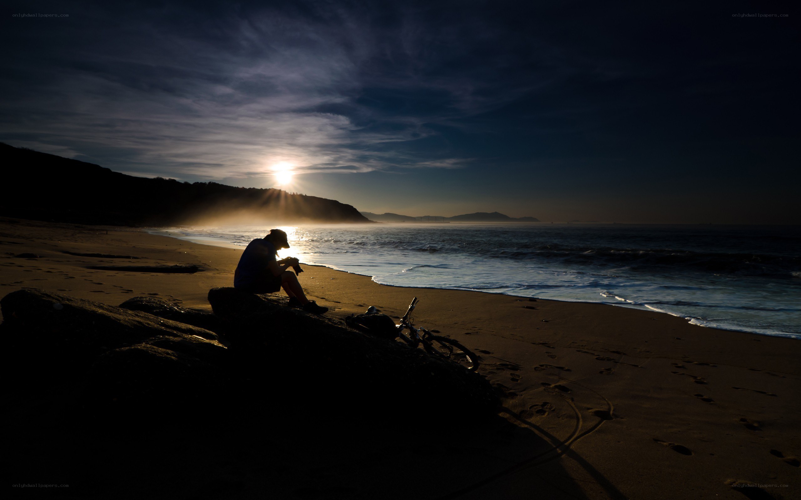 Person on beach at sunset