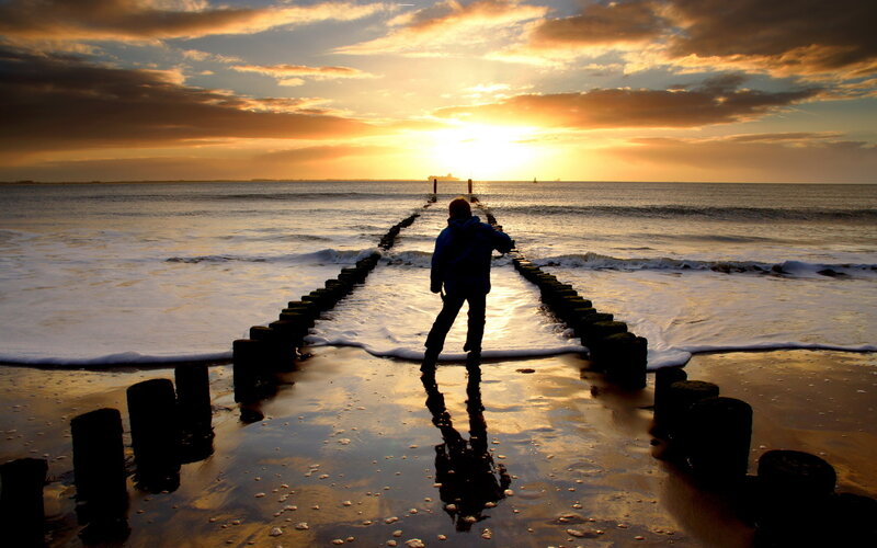 Person on Beach at Sunset — Orange, Dramatic
