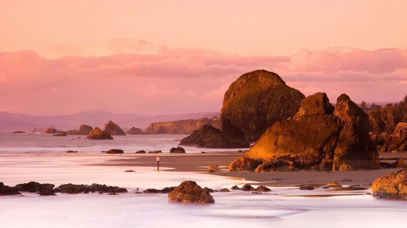 Person on Beach at Sunset — Pink, Serene, Photograph, Rocks
