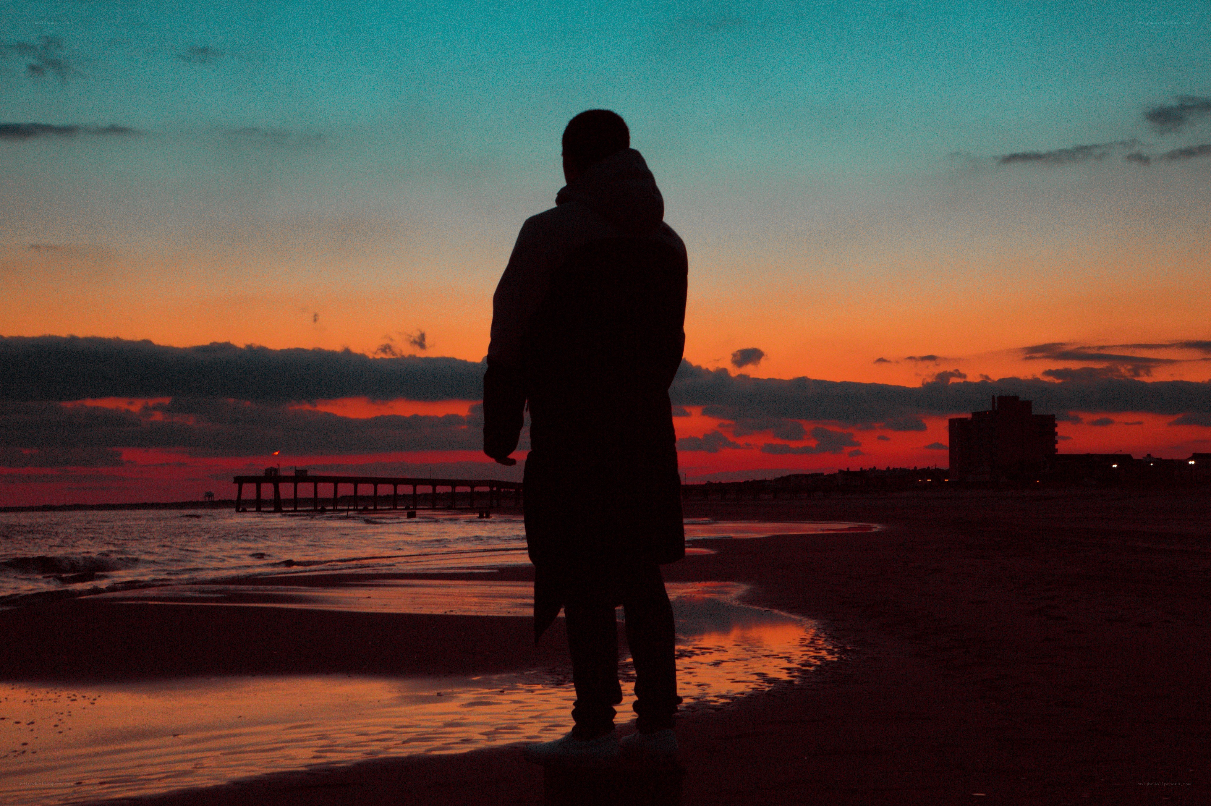 person on beach at sunset