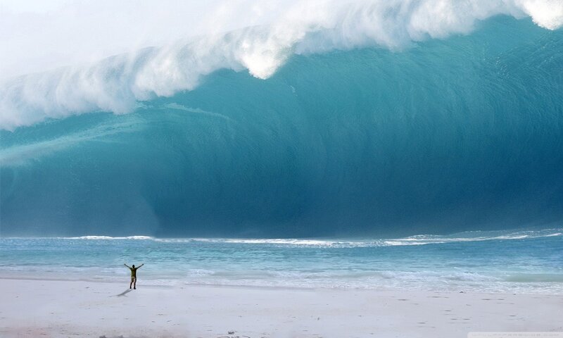 Person on Beach Facing Wave