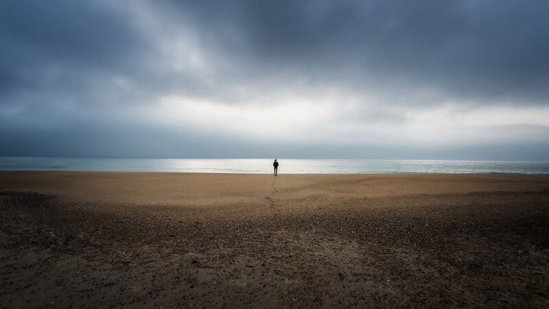Person on Beach — Gray, Dramatic