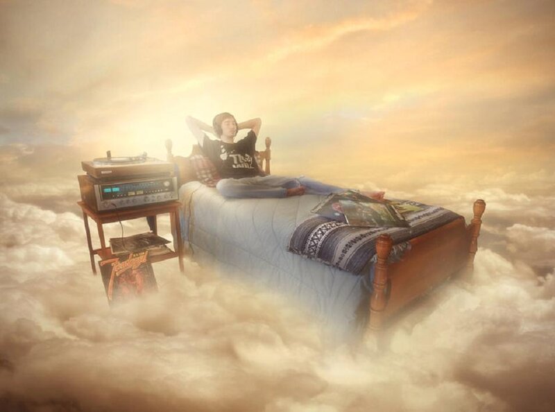 Person on Bed in Clouds