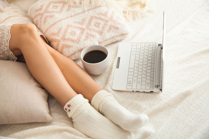 Person on Bed with Laptop — White