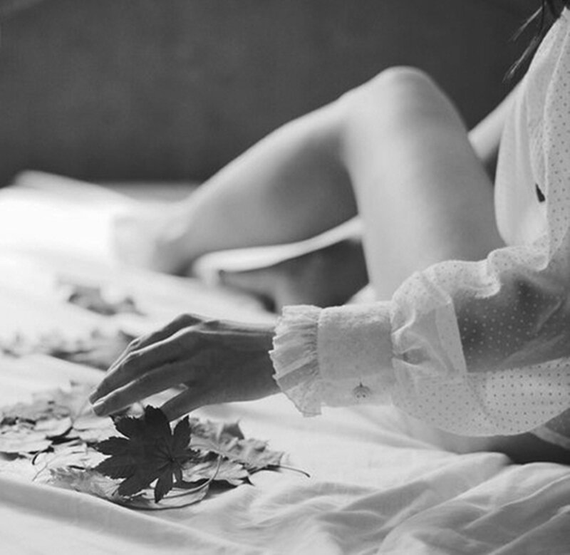 Person on Bed with Leaves
