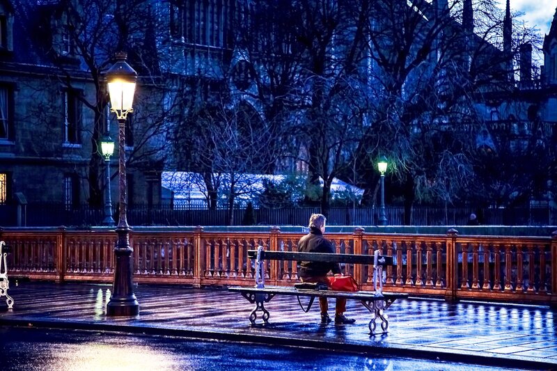 Person on Bench at Night — Blue