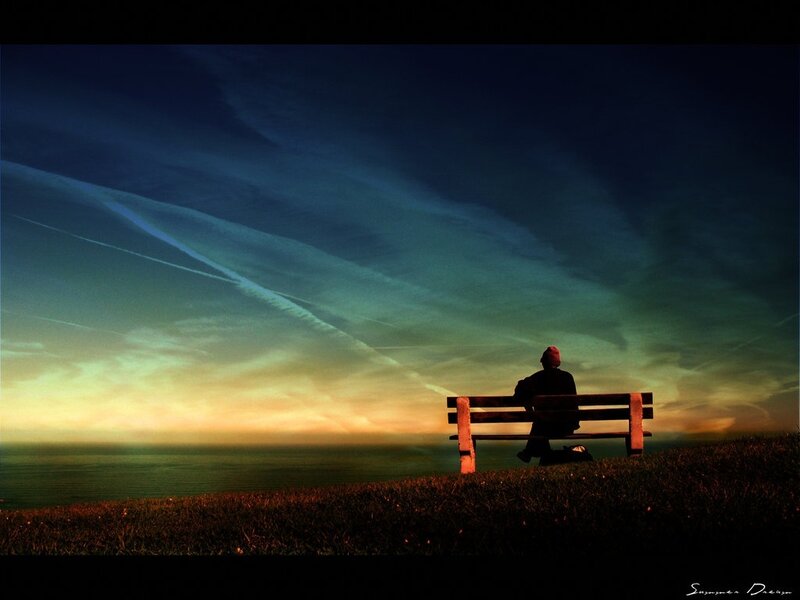 Person on bench at sunset