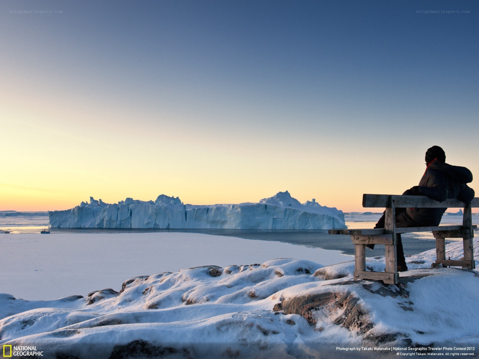 Person on bench with iceberg