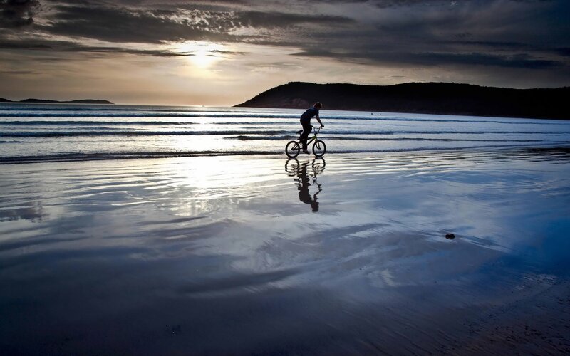 Person on Bicycle — Blue, Serene, Sunset