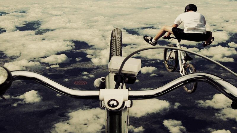 Person on Bicycle in Clouds
