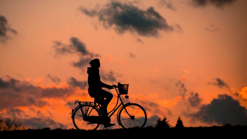 Person on Bicycle — Orange, Dramatic
