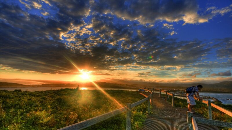 Person on Boardwalk at Sunset — Blue