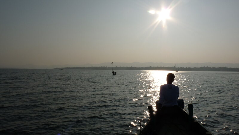 Person on Boat at Sunset — Blue
