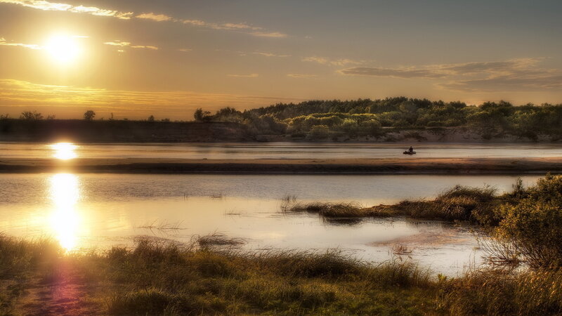 Person on Boat at Sunset — Gold