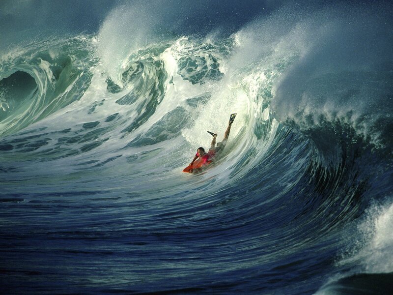 Person on Bodyboard in Wave