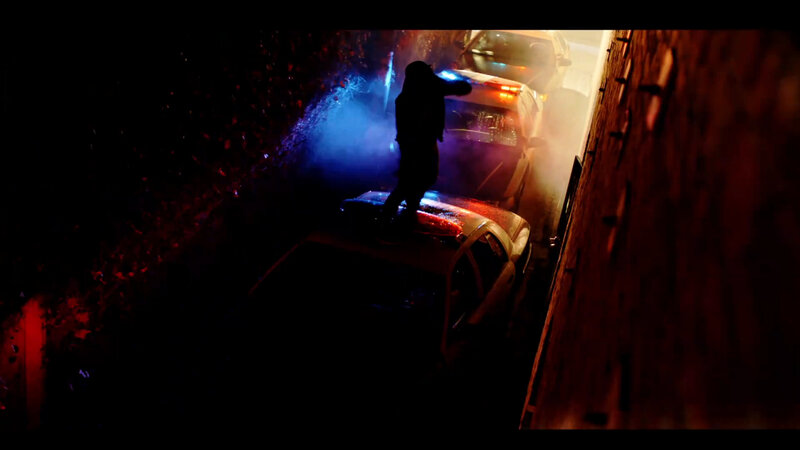 person on car roof at night