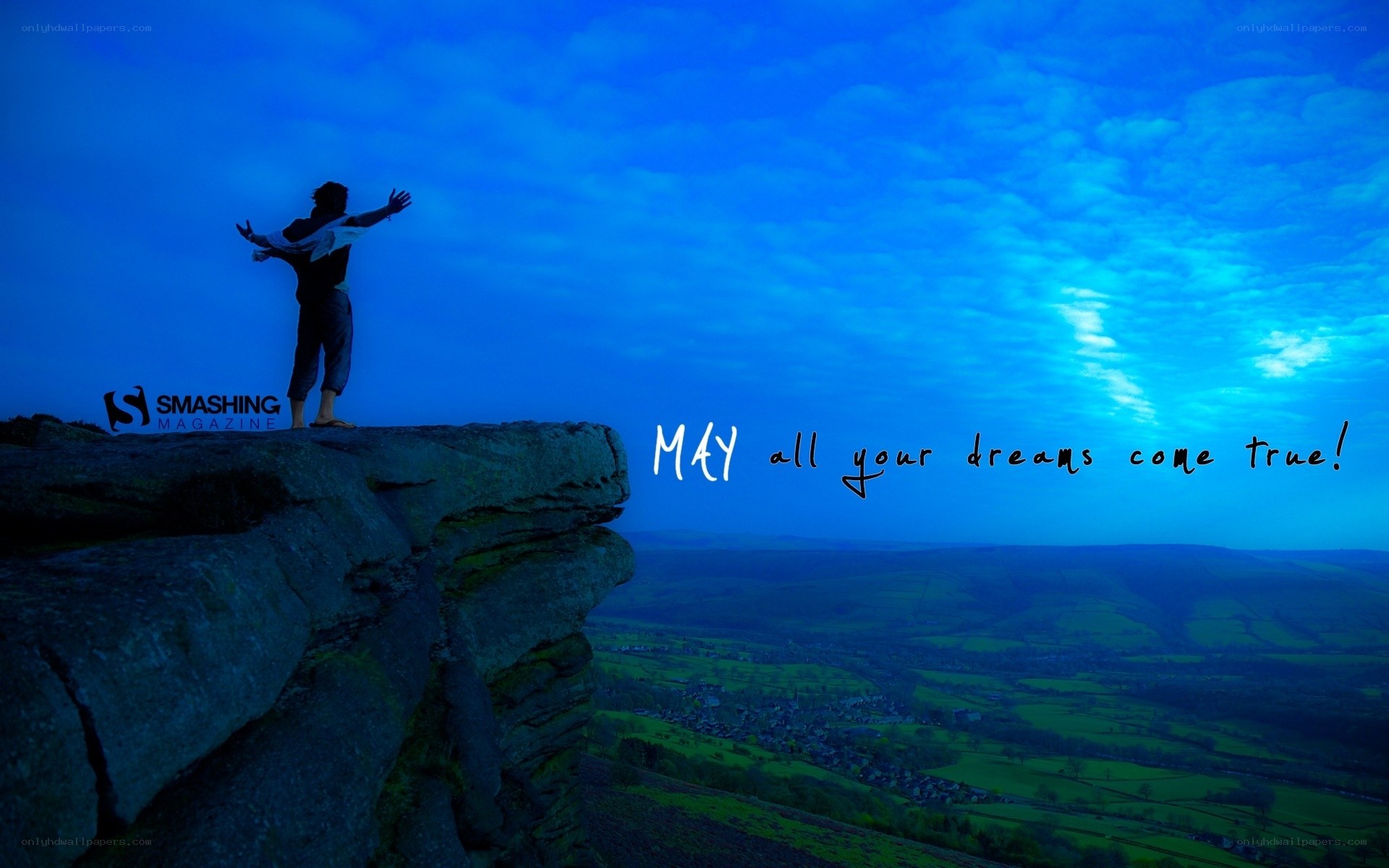 person on cliff at dusk