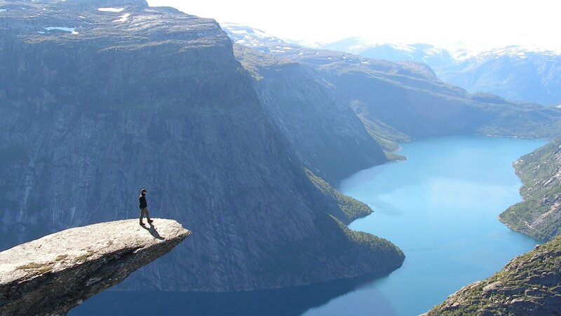 Person on Cliff Edge — Blue, Dramatic, Afternoon, Photograph, Fjord