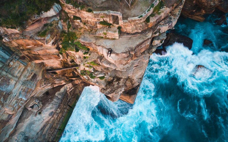 Person on Cliff Edge — Blue, Dramatic, Afternoon, Photograph, Ocean