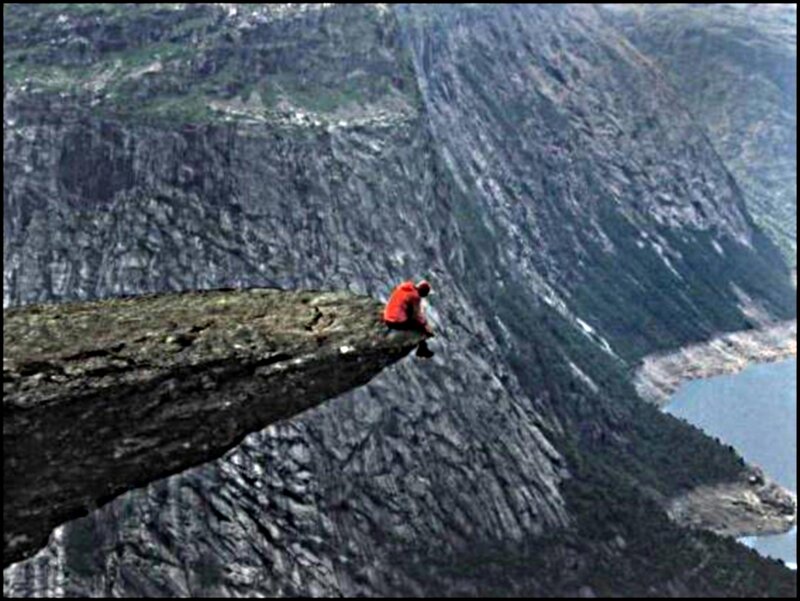 Person on Cliff Edge — Gray, Dramatic, Photograph