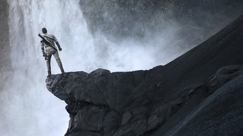 Person on Cliff Edge — Gray, Dramatic, Photograph, Waterfall