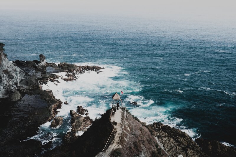 Person on Coastal Cliff