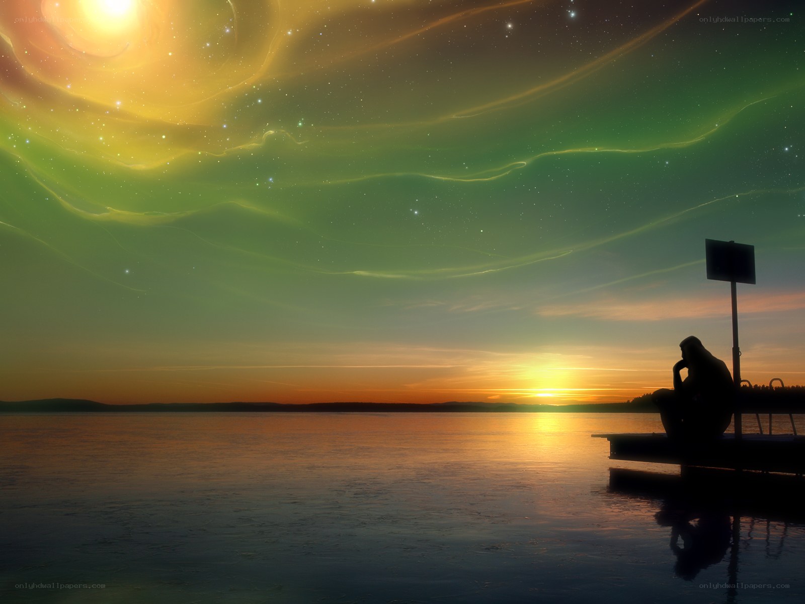 Person on dock at sunset