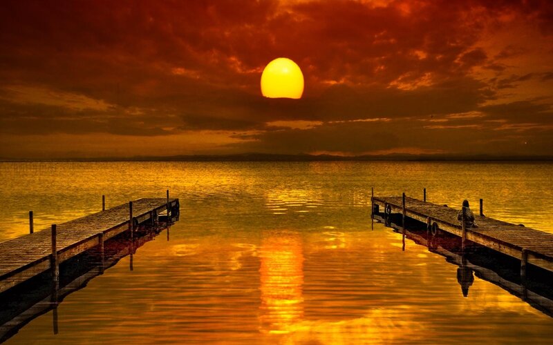 Person on Dock at Sunset — Orange
