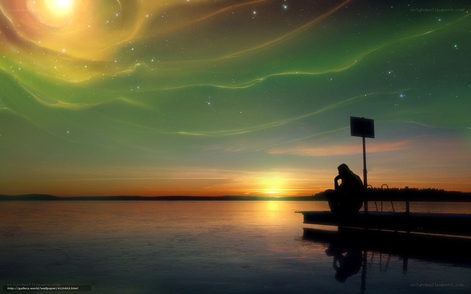 Person on dock at sunset