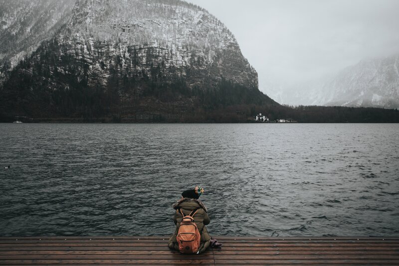 Person on dock by lake