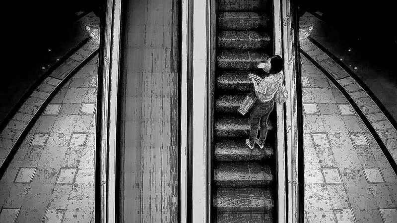 Person on Escalator