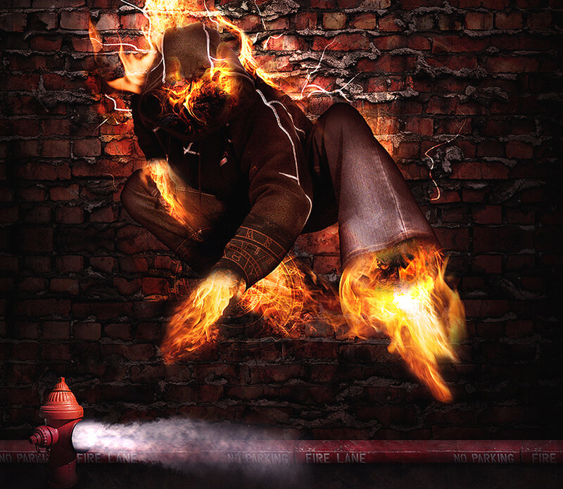 person on fire against brick wall