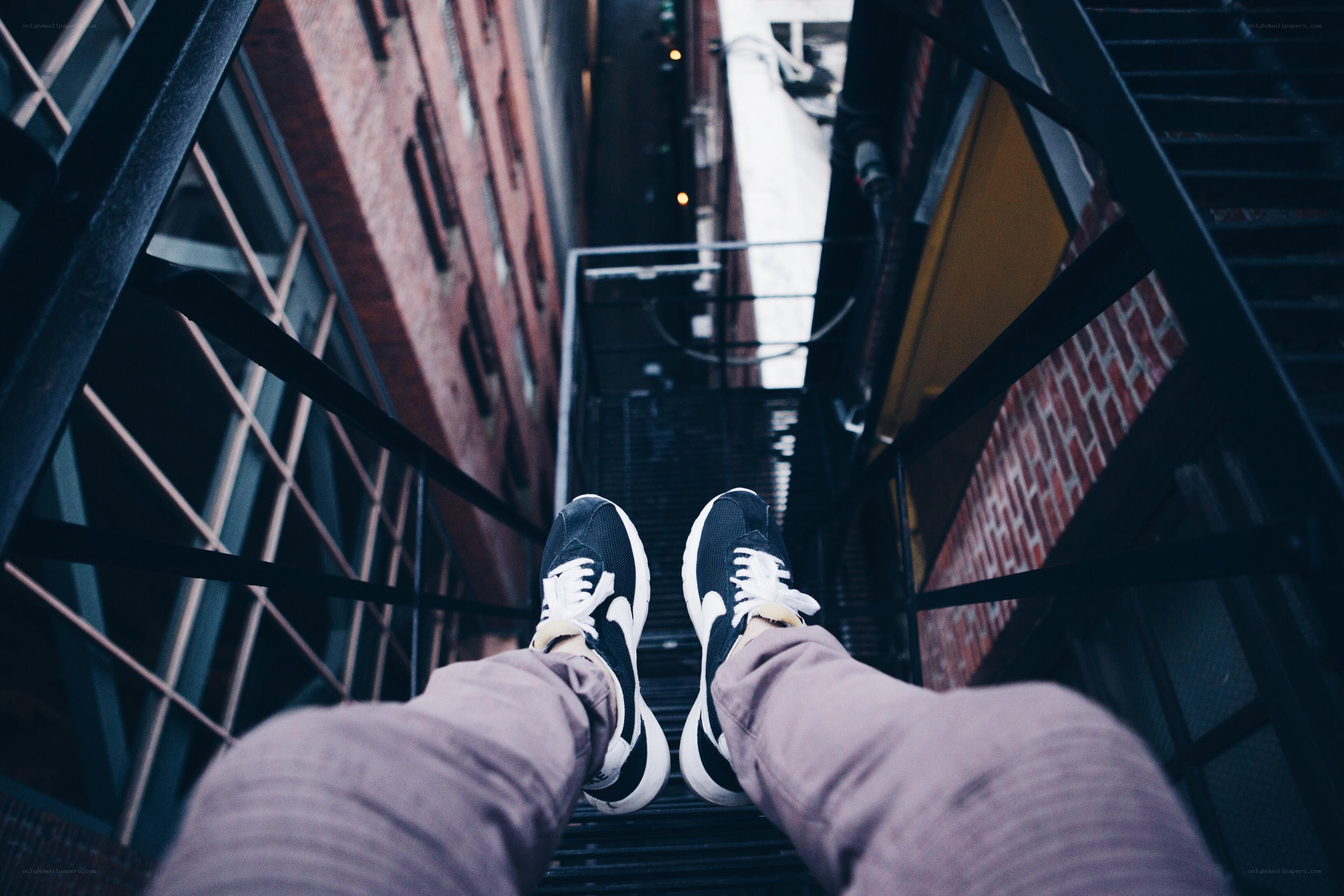 person on fire escape stairs