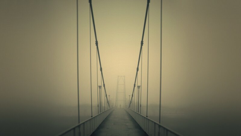 Person on Foggy Bridge — Gray