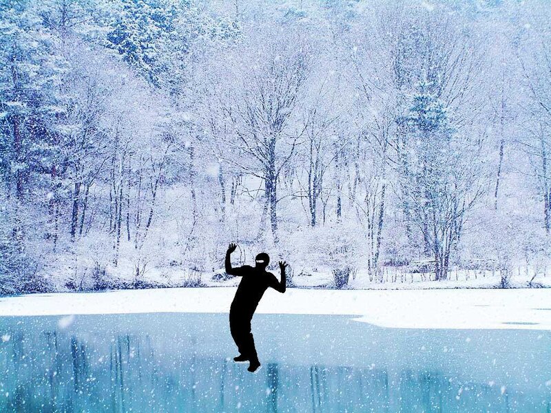 person on frozen lake in snow