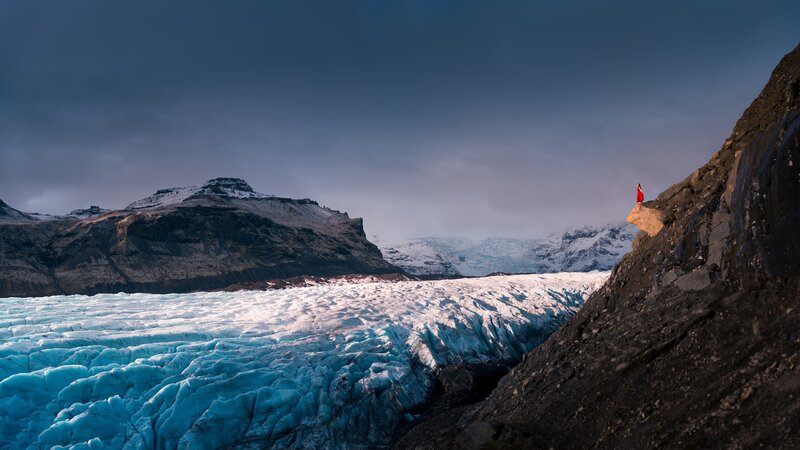 Person on Glacier Cliff