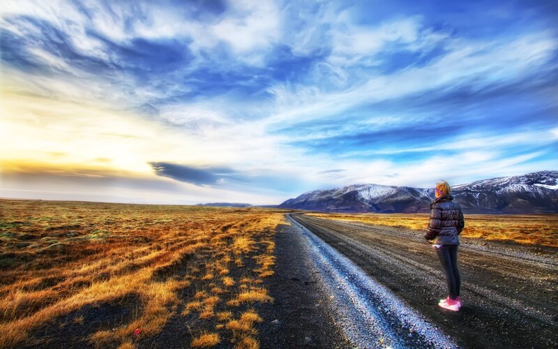 Person on Gravel Road — Blue