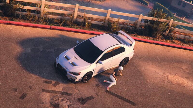 Person on Ground Near Car