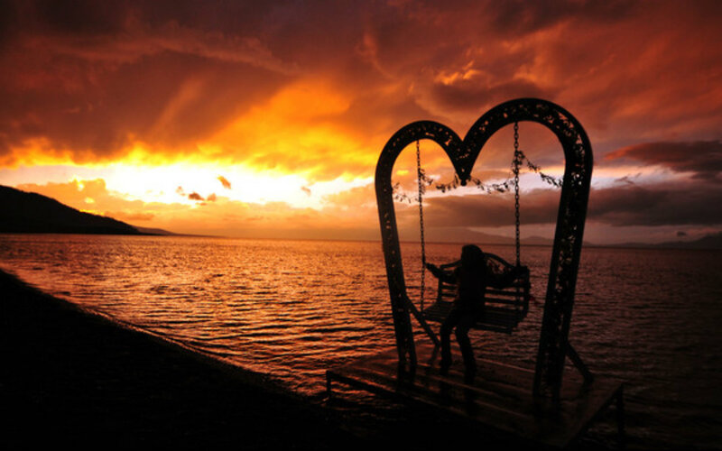 Person on Heart Swing