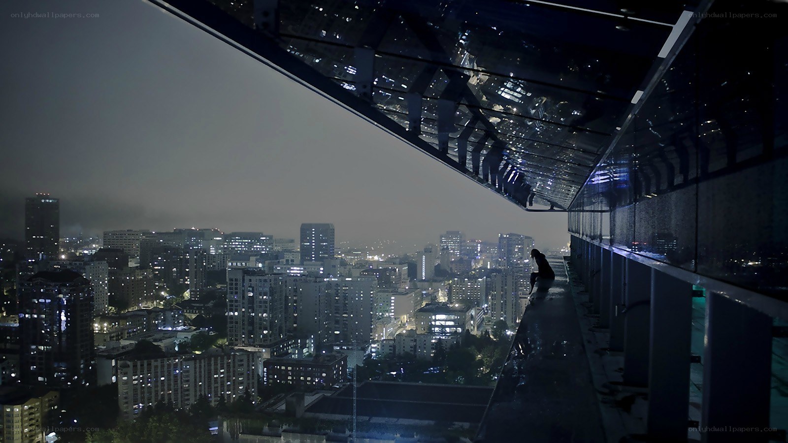 Person on high building edge