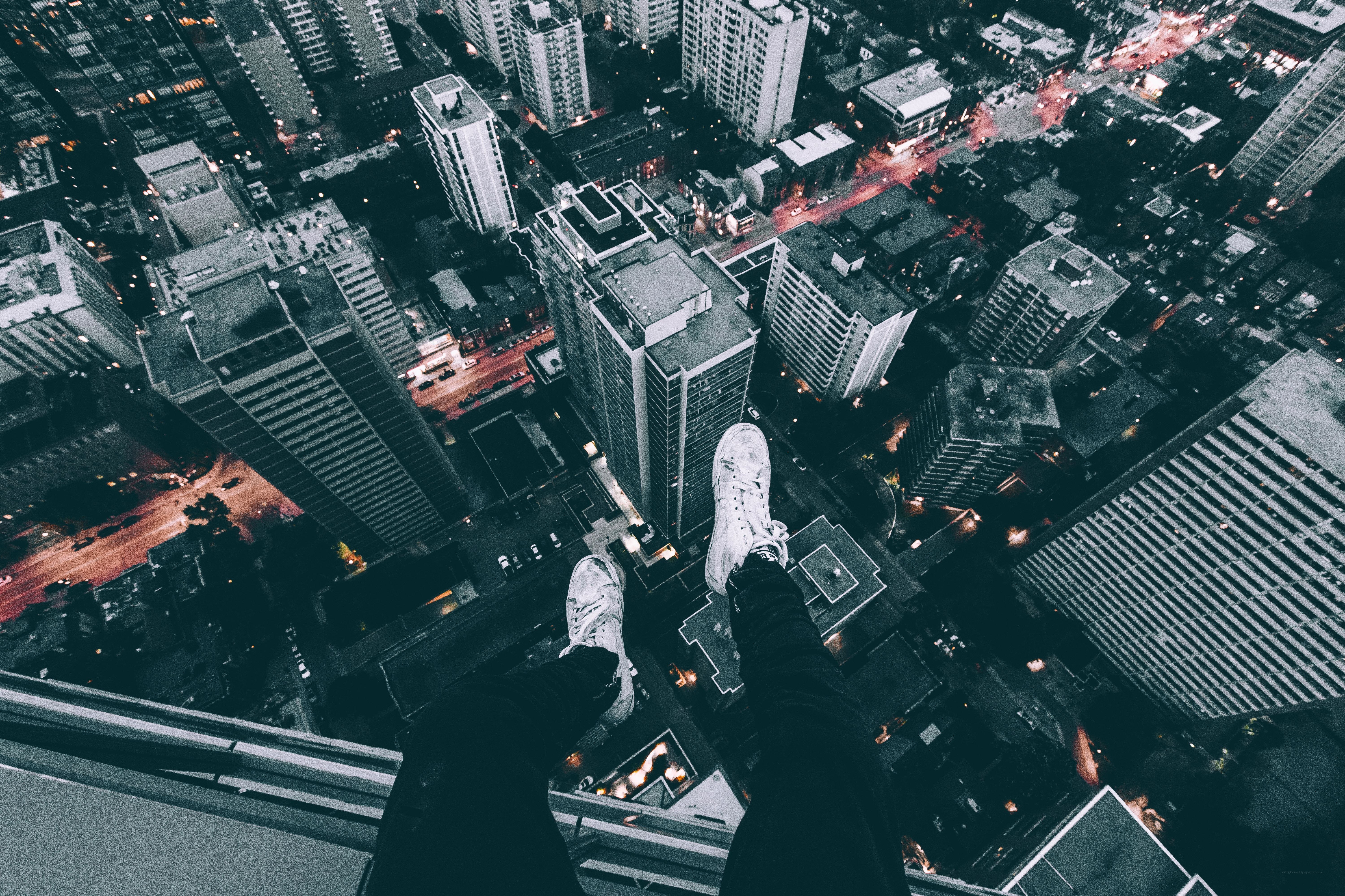 person on high building edge
