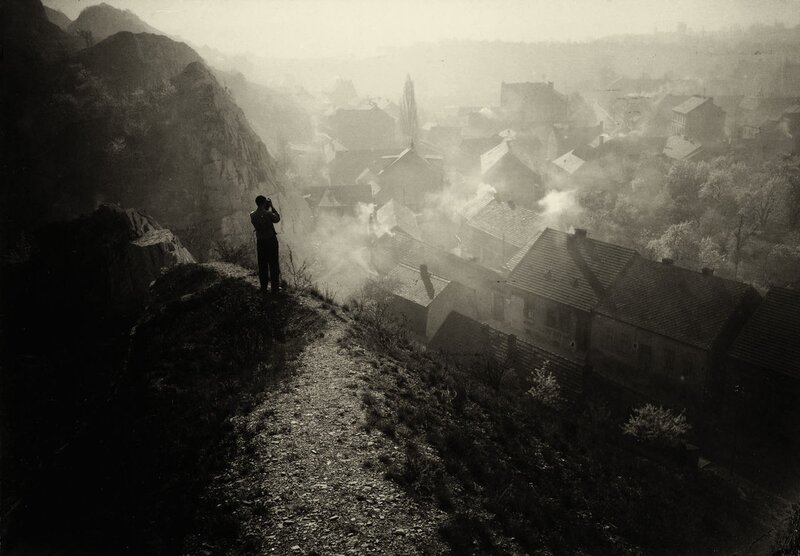 Person on Hill Overlooking Town