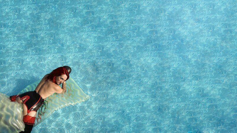 person on inflatable in pool