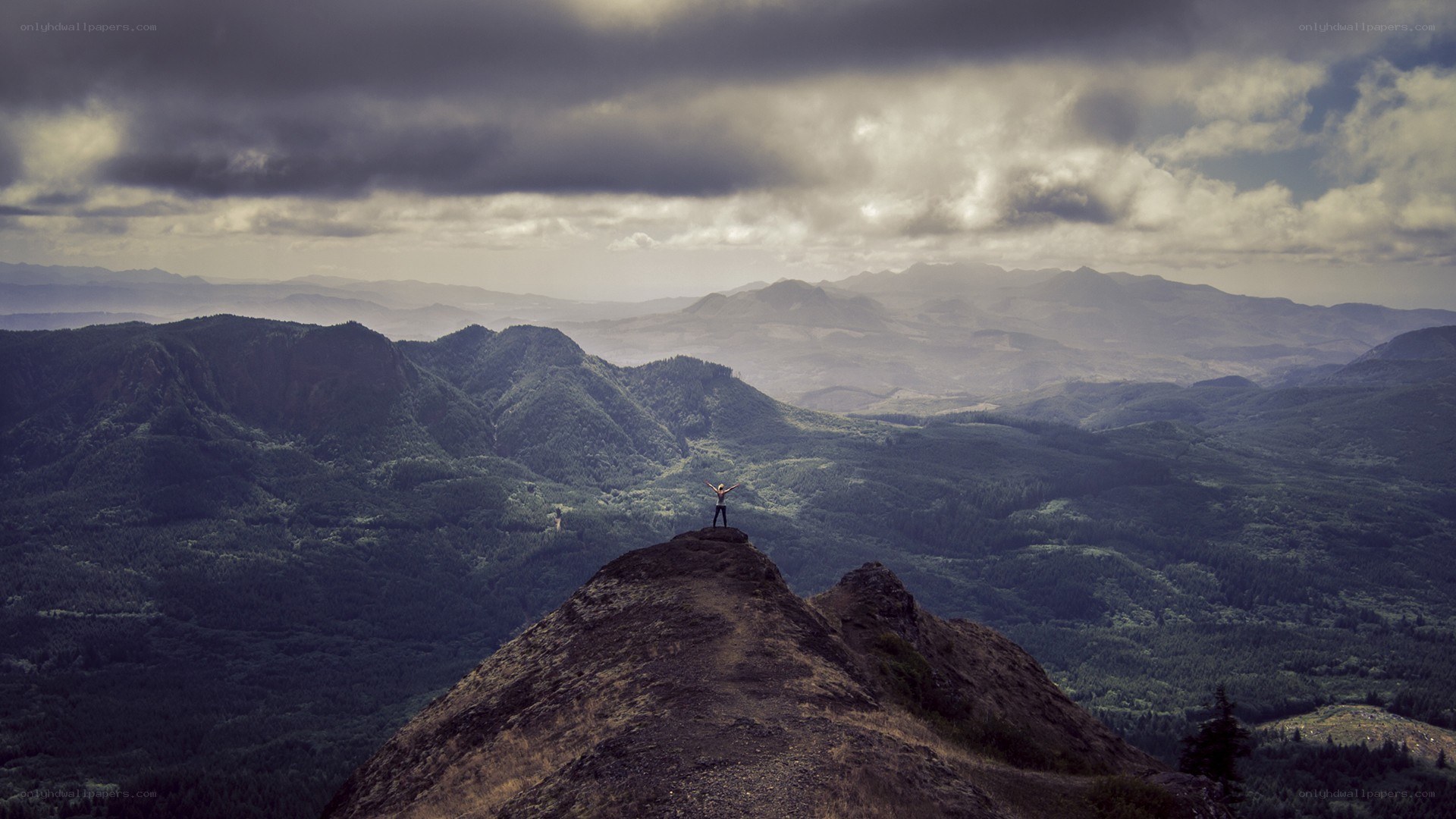 person on mountain peak