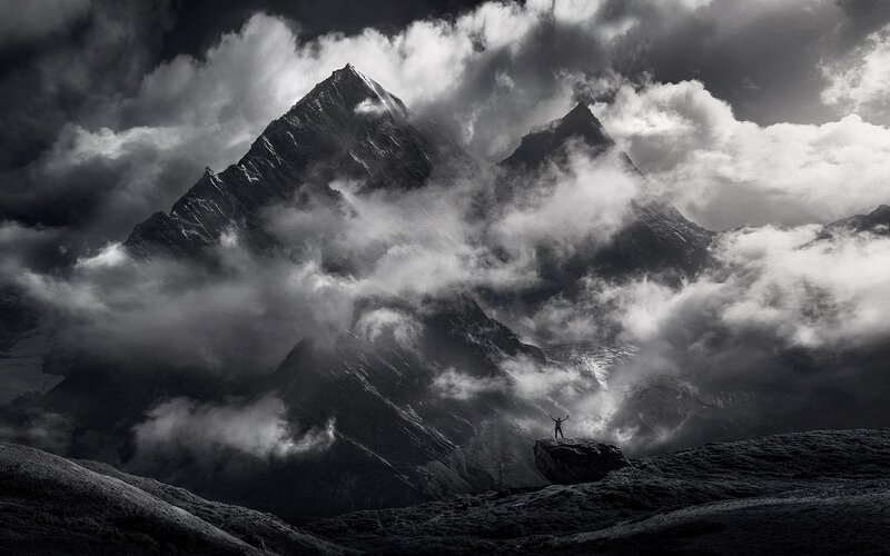 Person on Mountain Peak — Black