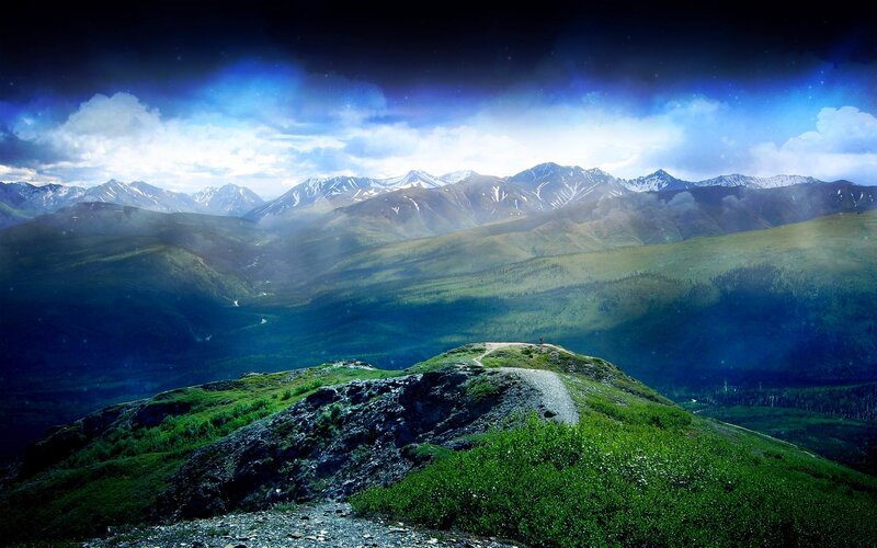 Person on Mountain Peak — Blue, Dramatic