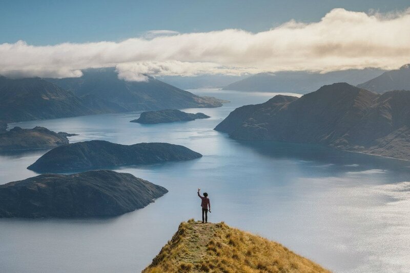 Person on Mountain Peak — Blue, Serene, Afternoon, Photograph, Lake